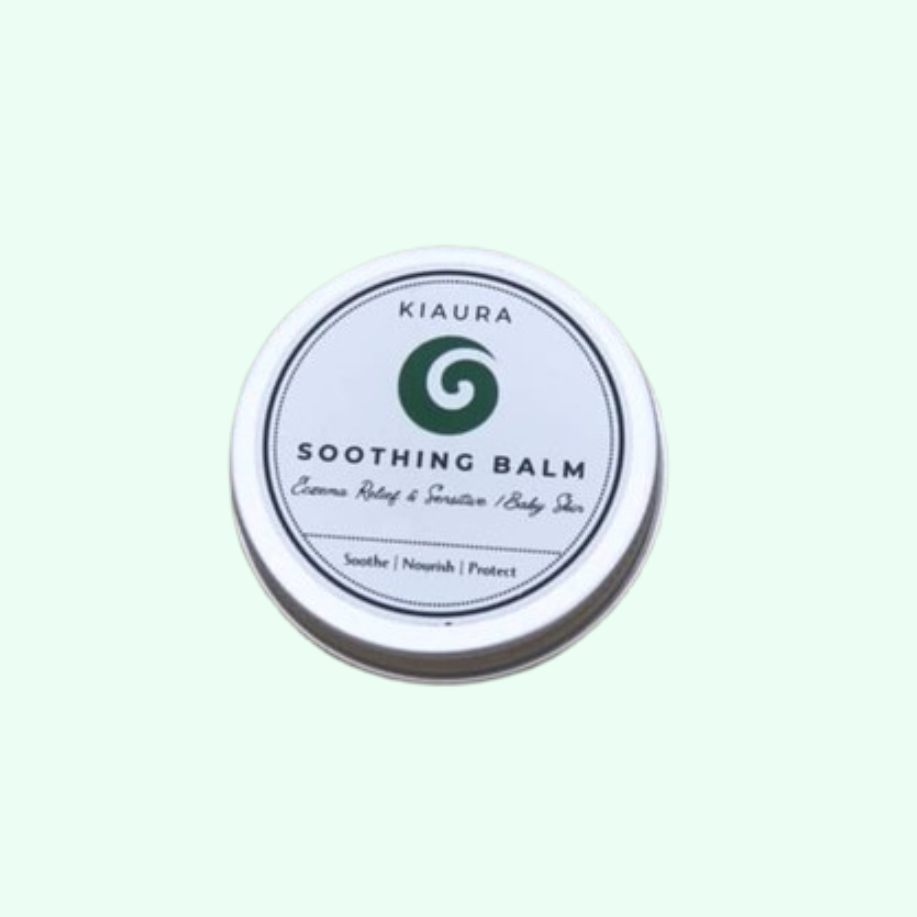 Kiaura Soothing Balm container on a light green background