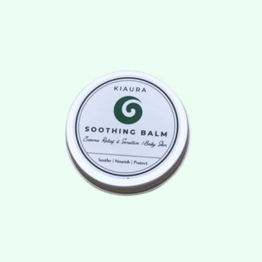 Kiaura Soothing Balm container on a light green background