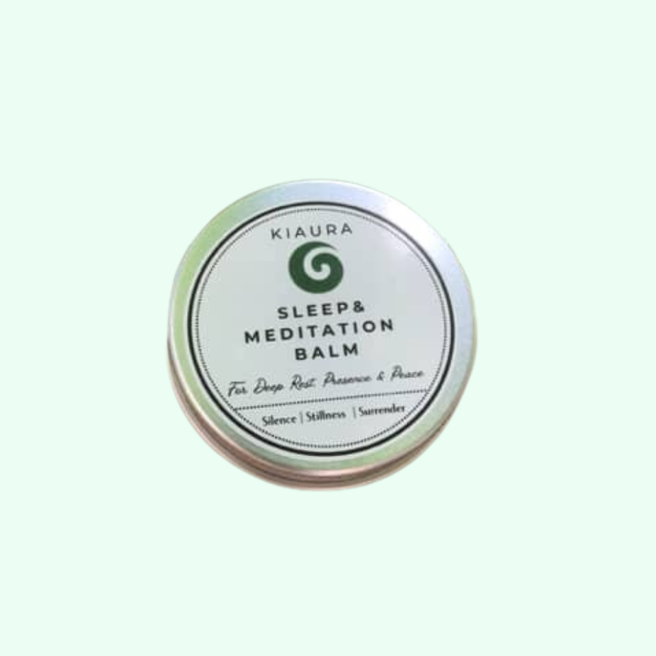 Kiaura Sleep & Meditation Balm tin on a light green background